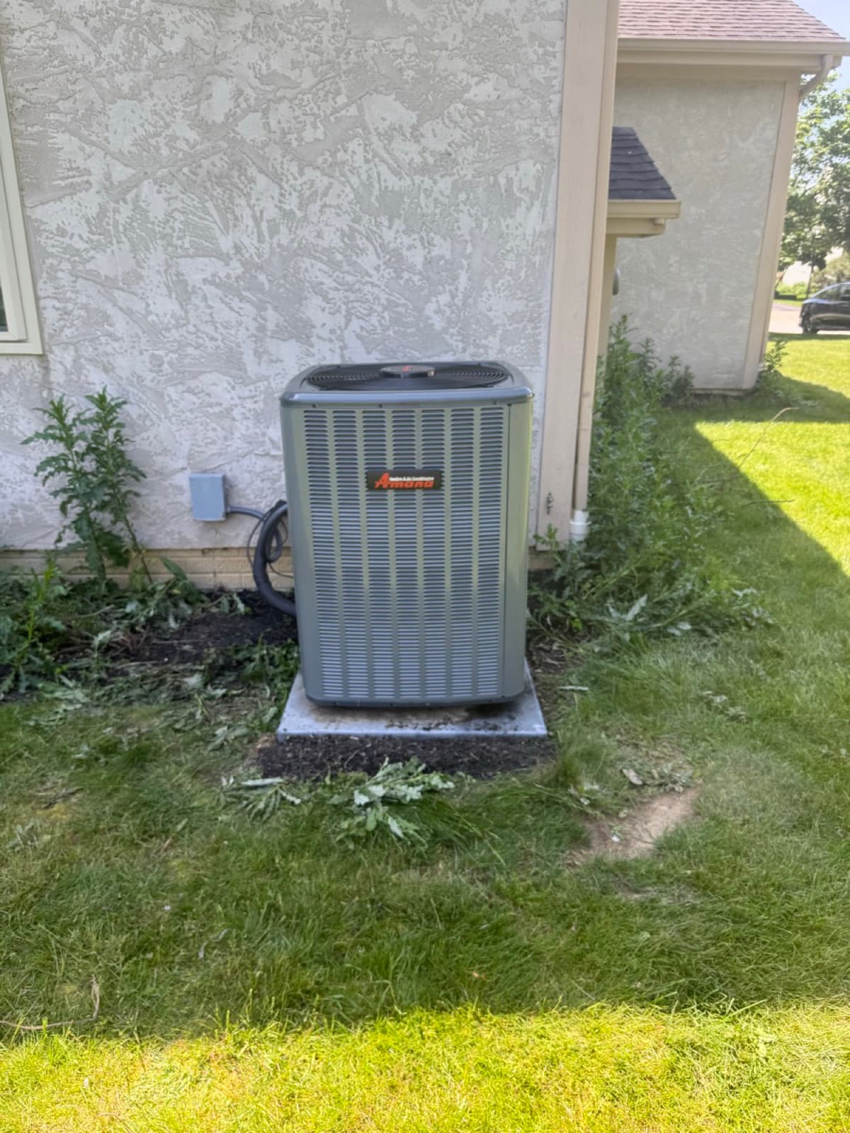 Amana AC condenser installation at a residential home